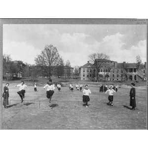  Girls jumping low hurdles on athletic field,Winthrop College 