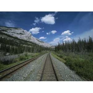 Train Tracks Winding Their Way Through the Canadian Rockies Stretched 