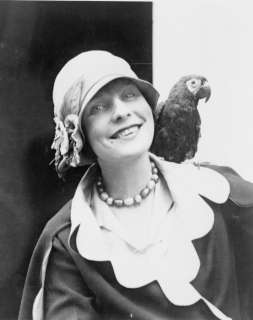 1920s photo young woman with pet parrot  