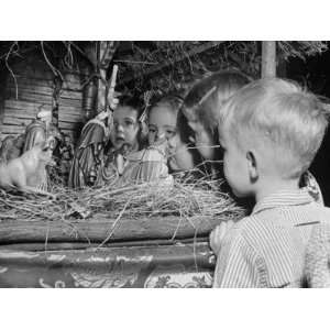 Children Looking at the Creche Displayed in a Church Photographic 