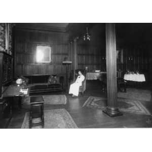  1915 photo Young woman sitting in chair in parlor. Senior 