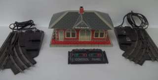   presents this vintage Tin O Scale Train Set with the following
