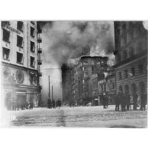 The Winchester Hotel burning,c1906,people standing on street,smoke 