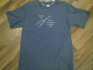 Eden Outfitters New Guitar/Ukulele T Shirt Music Is  