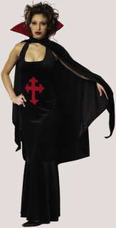 Costume includes  full length low cut dress with medieval style crest 
