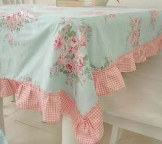   tablecloth that has oodles of roses very cute pink checked gingham