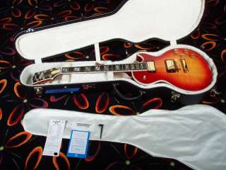   re looking at a 2006 gibson les paul supreme with a cherry sunburst